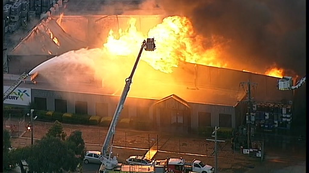 About 80 firefighters are battling a large factory fire in Campbellfield, North Melbourne. Nearby residents are being urged to avoid the area.    