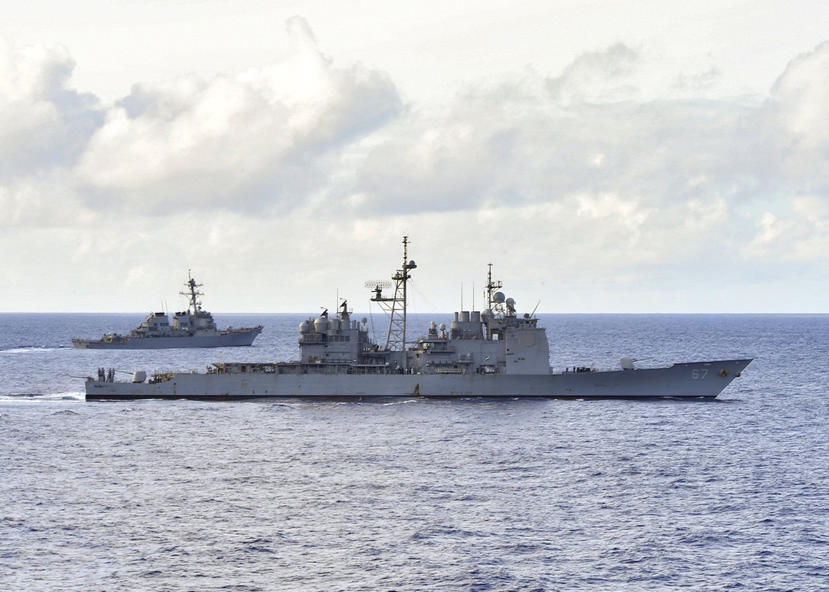 Japan-based US cruiser SHILOH CG67 on patrol this month in the Philippine Sea: launching an SM-2 Standard missile during exercises on 19 March; firing her forward Mk45 5-inch gun on 10 March; underway with destoyer BARRY DDG52 on 17 March