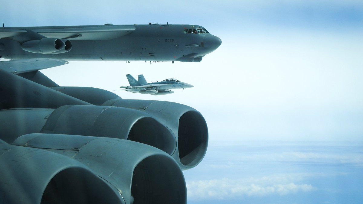 Two @usairforce B-52 Stratofortress bombers integrated with @USNavy E/A-18G Growlers during a BTF mission near the Kuril Islands on June 18