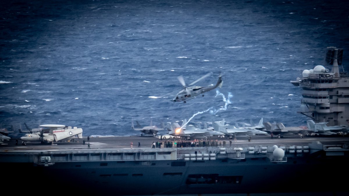 USA: US Navy photos showing the nuclear-powered aircraft carrier USS Carl Vinson (CVN 70) conducting a change of air command ceremony in the Philippine Sea