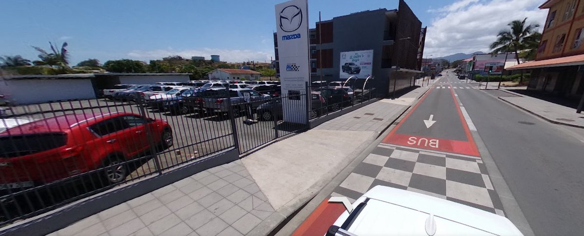 The parking lot of the Mazda Vallée du Tir dealership in Nouméa